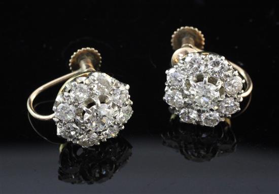 A pair of mid 20th century gold and diamond cluster ear clips,